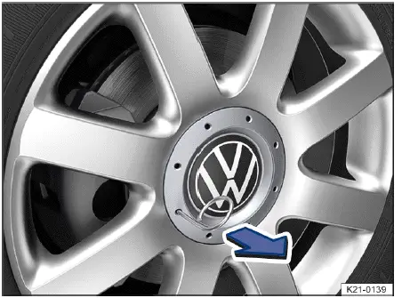 Volkswagen ID.4 removing hubcap with extraction hook alloy and steel wheel method