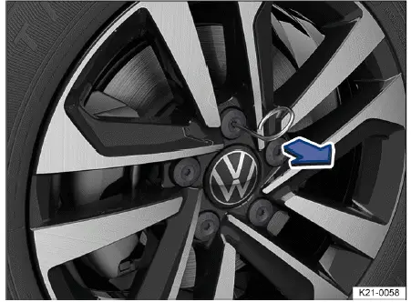 Volkswagen ID.4 removing wheel bolt caps with extraction hook protective covers